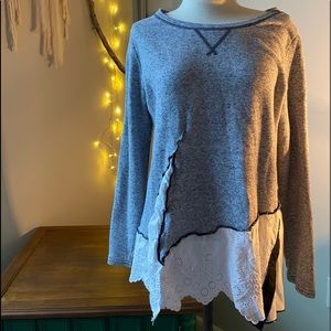 Shirt with eyelet asymmetrical hem